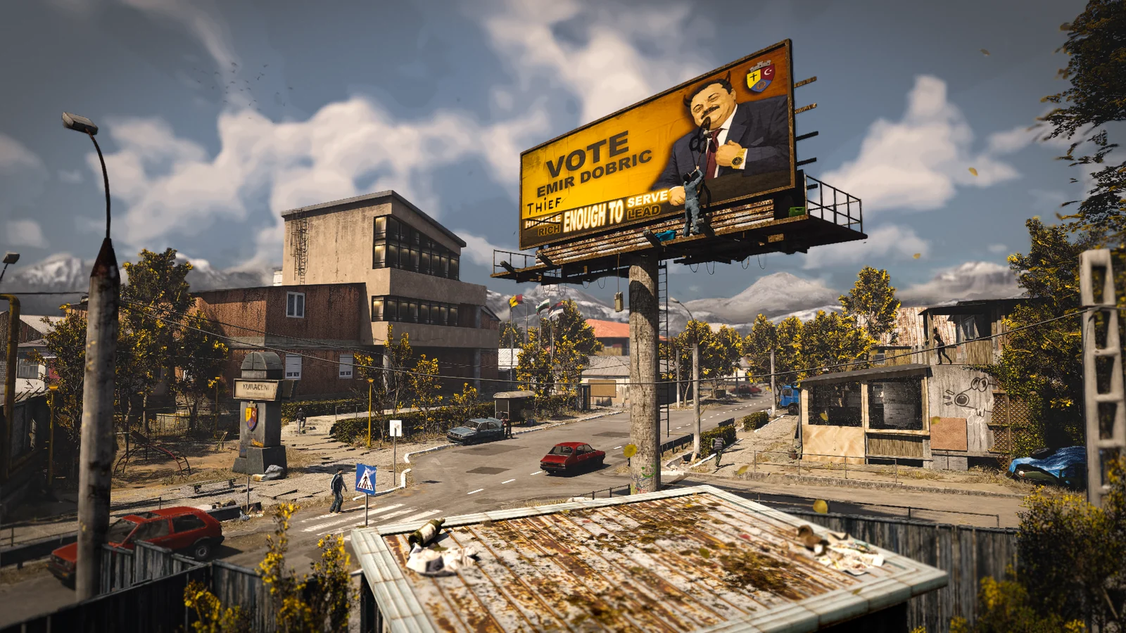 A weathered town street beneath a political billboard, with mountains in the distance.