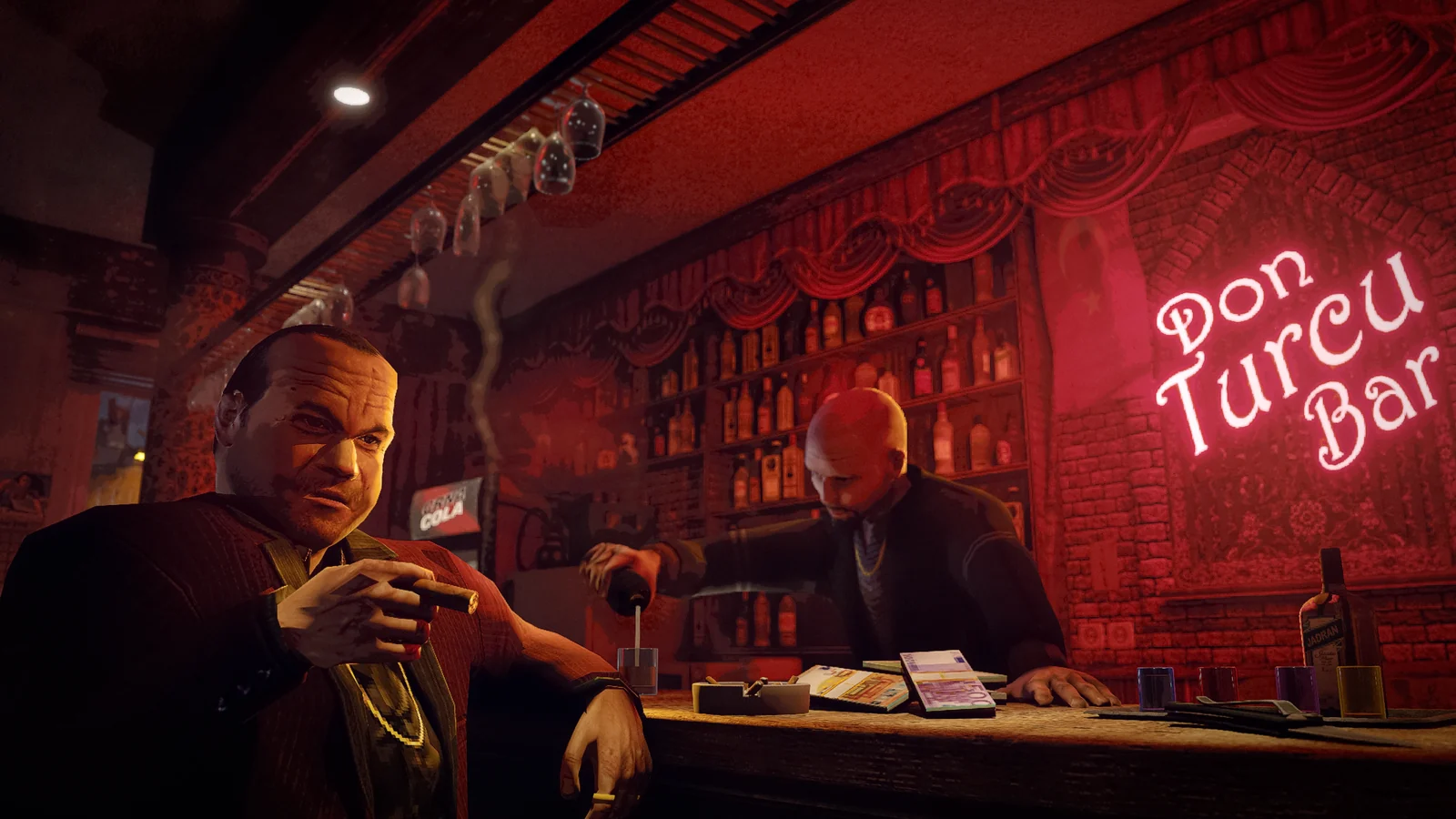 A man with a cigar sits beside the counter while a drink is poured at Don Turcu Bar.