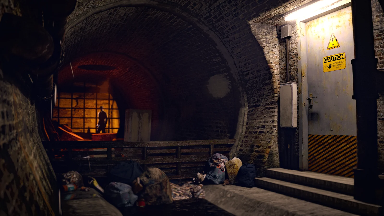 A brick service tunnel with a metal doorway, exposed pipes and discarded rubbish.